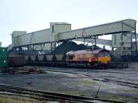 Traction changes but the South Wales long association with coal continues. A gritty scene at the Onllwyn coal washery. At least rail served even if the coal comes in by truck from opencast.<br><br>[Ewan Crawford 06/07/2006]