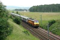 90031 with the Glasgow portion of the Lowland Sleeper north of Carstairs on 8 August 2006.<br><br>[John Furnevel /08/2006]