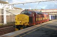 <h4><a href='/locations/C/Carstairs'>Carstairs</a></h4><p><small><a href='/companies/C/Caledonian_Railway'>Caledonian Railway</a></small></p><p>Edinburgh portion of the Lowland Sleeper preparing to leave Carstairs on 11 July 2006 behind EWS 37405. 24/42</p><p>/07/2006<br><small><a href='/contributors/John_Furnevel'>John Furnevel</a></small></p>