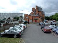 Looking south at the rather fine former Welshpool station building. The footbridge connects to the re-sited station.<br><br>[Ewan Crawford 10/07/2006]